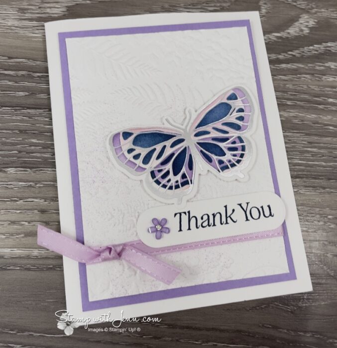 Side view showing the metallic shine on an elegant silver butterfly card