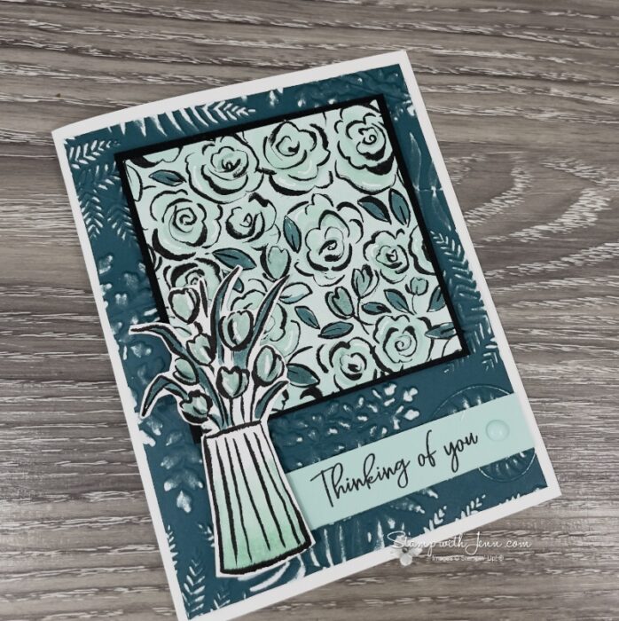Side view of Pretty Peacock Two Tone Cardstock embossed and sanded to reveal the white core