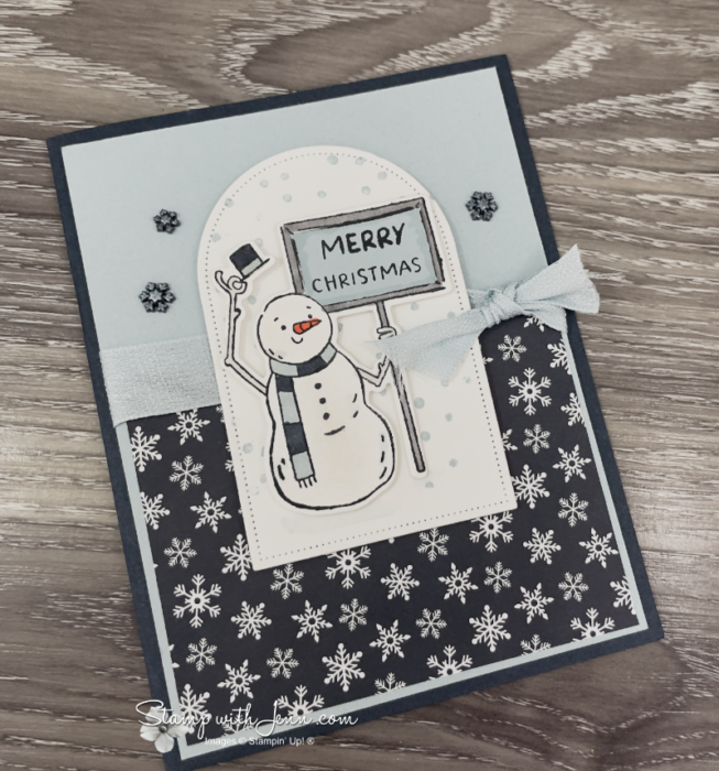 Snowman Christmas card with arched label and snowflake patterned paper.